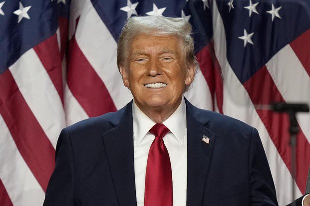 Republican presidential nominee former President Donald Trump smiles at an election night watch party