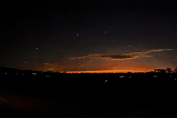 Photo shows the evening sky and points of light near Lebanon Township, New Jersey