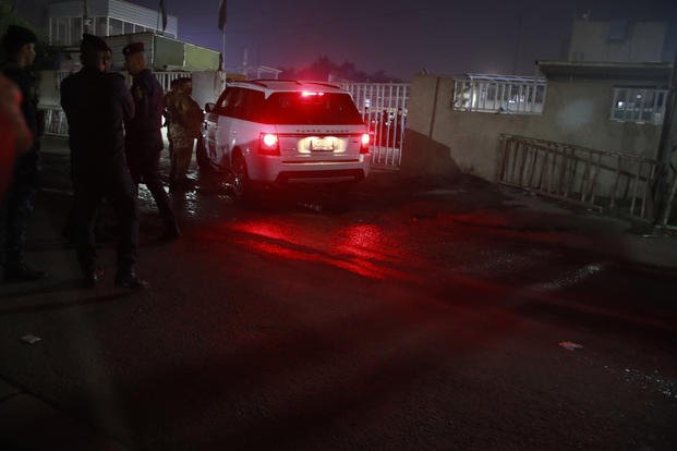 Iraqi security forces outside morgue of Sheikh Zayed Hospital in Baghdad