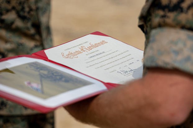 U.S. Marine reenlists during a ceremony on Camp Courtney, Okinawa