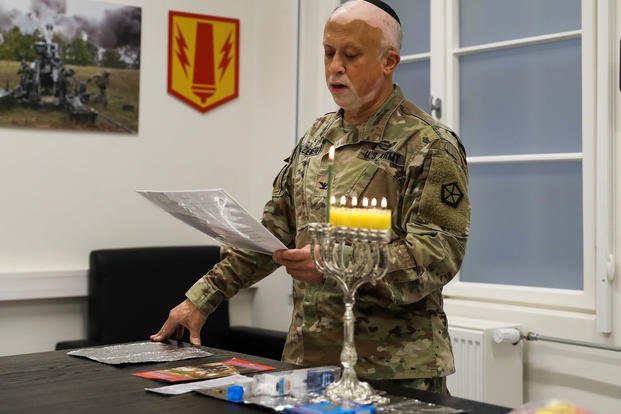 U.S. Army Col. Shmuel Felzenberg, a chaplain assigned to V Corps, reads the blessings at Camp Kosciuszko, Poznan, Poland.