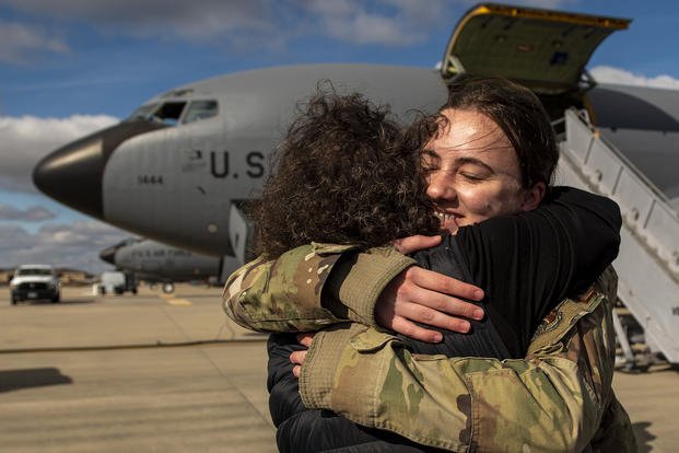 An airman from the 121st Air Refueling Wing arrive home from deployment to a crowd of family and friends at Rickenbacker Air National Guard Base, Ohio