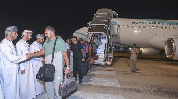  crew of the Galaxy Leader arriving in Muscat, Oman