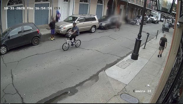 Shamsud-Din Jabbar rides on a bicycle in the French Quarter in New Orleans