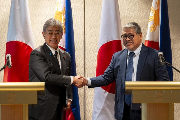 Japanese Foreign Minister Takeshi Iwaya, left, and Philippine Foreign Secretary Enrique Manalo