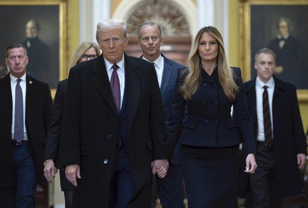 President-elect Donald Trump walks with Melania Trump at the Capitol