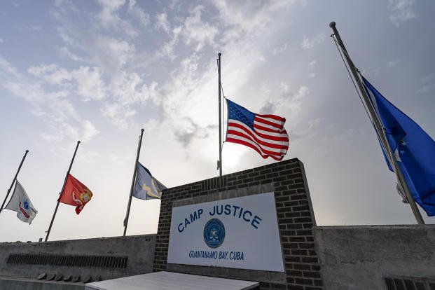 flags fly at half-staff at Camp Justice, Aug. 29, 2021, in Guantanamo Bay Naval Base
