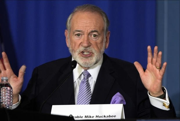 Former Arkansas Gov. Mike Huckabee gestures