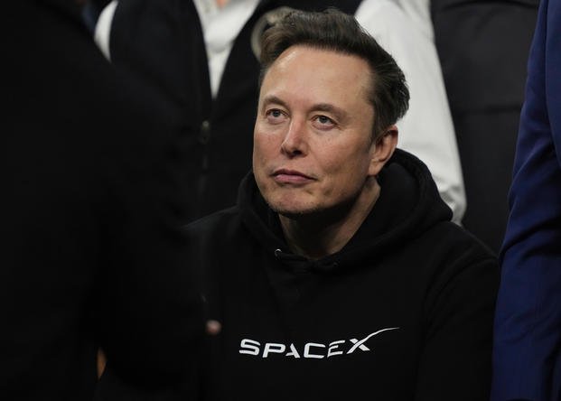 Elon Musk attends the finals for the NCAA wrestling championship