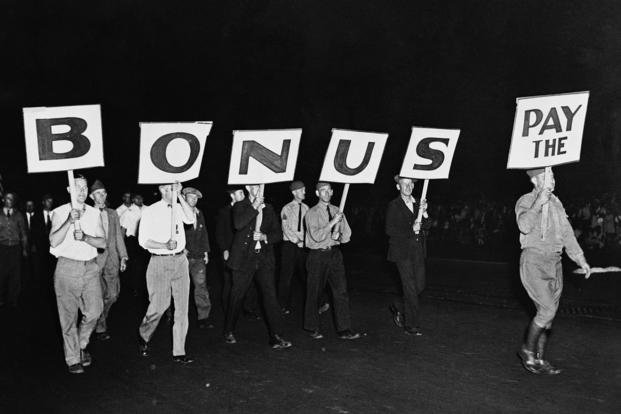 The ‘Pay the Bonus’ sign carried by this group of World War I veterans was typical of the banners throughout the demonstration in Washington.