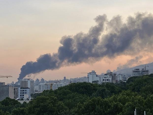 Smoke rises from the building of Iran's state-run television