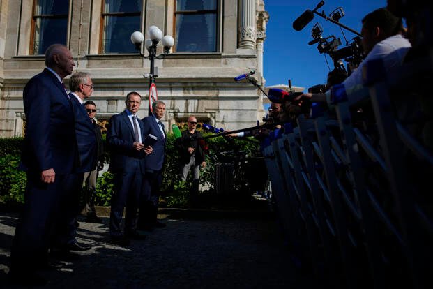 The head of the Russian delegation Vladimir Medinsky, center, speaks to the media