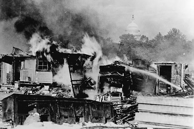 A Bonus Army encampment burns after the U.S. Army attacks WWI veterans protesting their treatment by the federal government. 