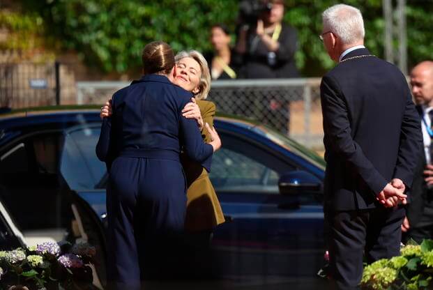 Denmark's Prime Minister Mette Frederiksen greets European Commission President Ursula von der Leyen
