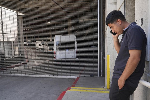 Alejandro Barranco talks on his cell phone
