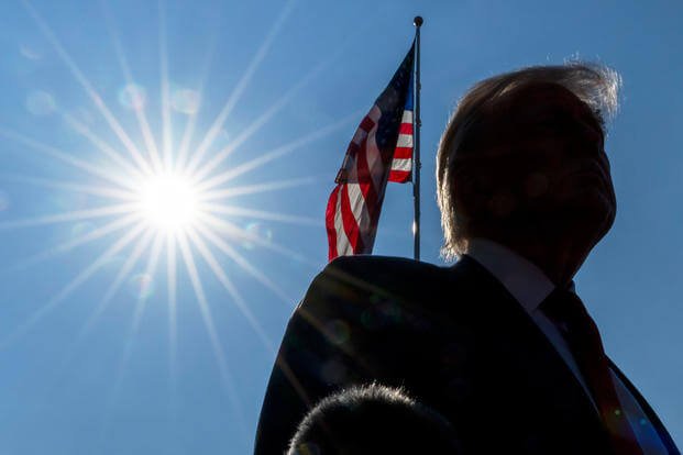 President Donald Trump speaks with reporters before departing on Marine One from the South Lawn of the White House