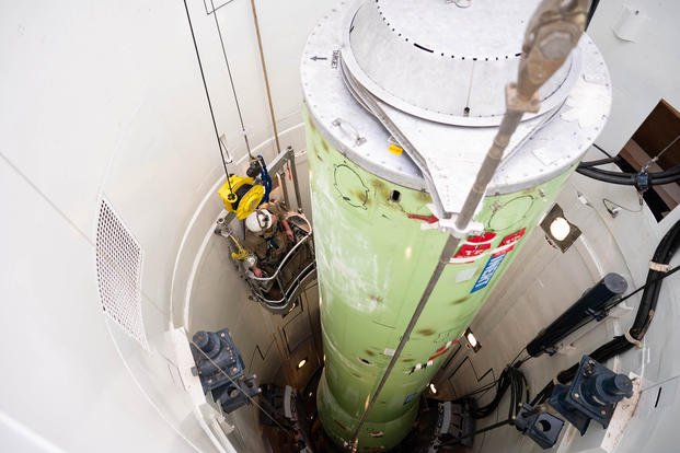 An Air Force airman is lowered into a training missile silo at Malmstrom Air Force Base in Montana on March 5, 2025. The Air Force is wrapping up an investigation into whether nuclear missile bases are unsafe places to work after members reported cancer diagnoses. (Mary Bowers/U.S. Air Force/TNS)