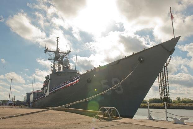 Plankowners and crew of guided-missile frigate USS Kauffman (FFG 59) man the rails as part of the ship's decommissioning ceremony on Sept. 18, 2015, in Norfolk, Va. (U.S. Navy photo/Shane A. Jackson)