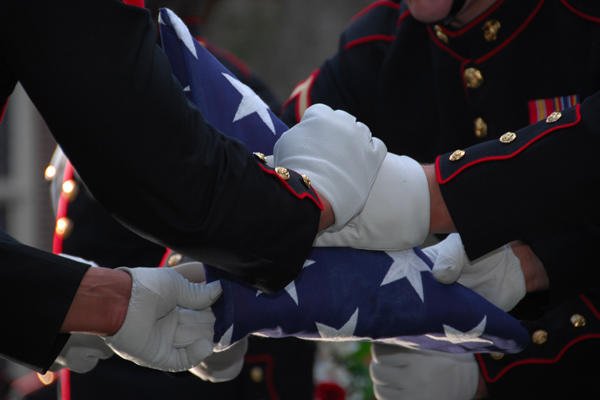 Flag folding for military funeral.