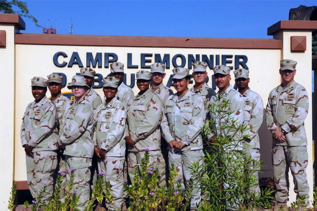 U.S. Navy sailors display their Dominance Warfare Specialist devices at Camp Lemonnier, Djibouti, October 29, 2011. (Air Force/Airman Jarad A Denton	)