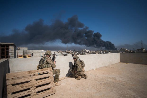 U.S. Army 82nd Airborne troops, deployed in support of Combined Joint Task Force- Operation Inherent Resolve, use a rooftop as an observation post in Mosul, Iraq, on March 7, 2017. Staff Sgt. Alex Manne/Army