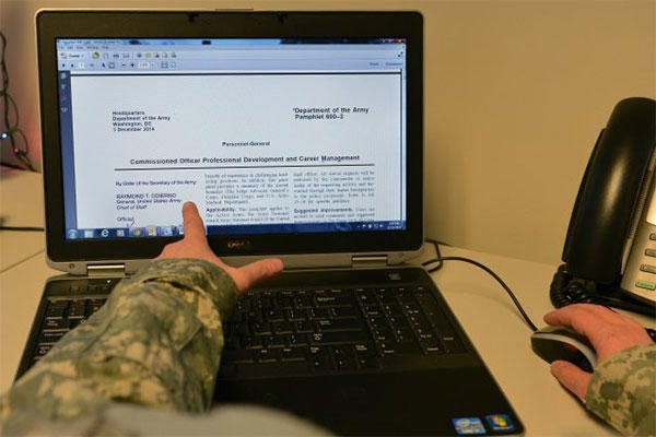 A soldier views Army Pamphlet 600-3, on Commissioned Officer Professional Development and Career Management. (U.S. Army Photo/JD Leipold)
