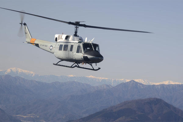 A UH-1N Iroquois helicopter flies over Japanese mountaintops on its way back to Yokota Air Base, Japan, Jan. 29, 2015, after completing a bilateral training mission. (U.S. Air Force photo/Senior Airman Michael Washburn)