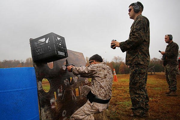 A Marine shoots an M9 Beretta down range on Stage 6 of the 2015 Combat Shooting Match on Marine Corps Base Quantico, Oct. 26-30. (U.S. Marine Corps/Cpl. Kathy Nunez)
