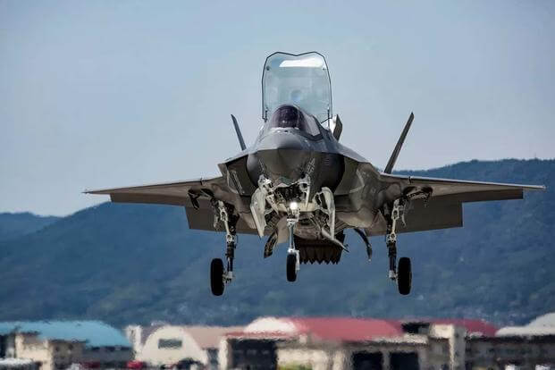 A U.S. Marine Corps F-35B Lightning II with Marine Fighter Attack Squadron 121, hovers overhead before a vertical landing at Marine Corps Air Station Iwakuni, Japan, June 13, 2017. (U.S. Marine Corps/Jacob A. Farbo)