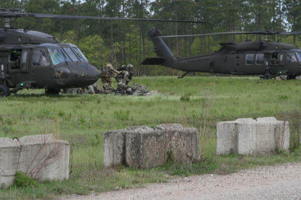 Paratroopers of the 82nd Airborne Division and the British 16 Air Assault Brigade conduct an assault for Combined Joint Operational Access Exercise 15-01 on Fort Bragg, April 18, 2015. (82nd Airborne Division photo/Staff Sgt. Jason Hull)