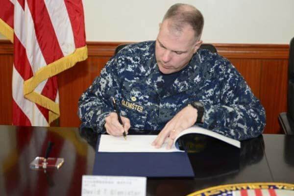 Capt. David T. Glenister signs a memorandum of agreement at the command headquarters building on Fleet Activities Yokosuka. (U.S. Navy photo by Mass Communication Specialist 1st Class Juan A. King/)