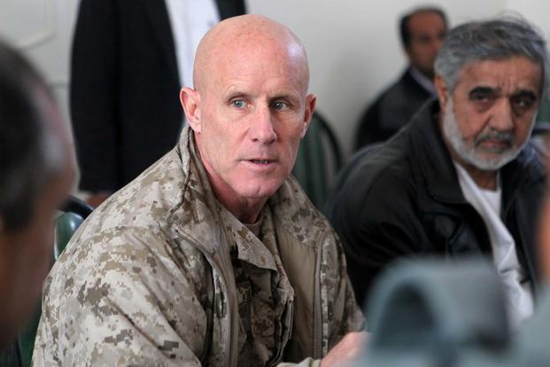 FILE -- Vice Adm. Robert S. Harward, commanding officer of Combined Joint Interagency Task Force 435, speaks to an Afghan official during his visit to Zaranj, Afghanistan, Jan 6, 2011 (DoD/ Sgt. Shawn Coolma)