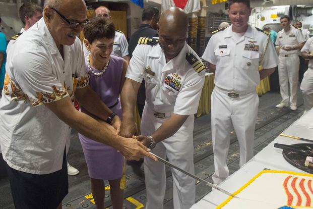 Fiji Pres. George Konrote, left, Ambassador Judith Cefkin, U.S. ambassador to Fiji, and Cmdr. Walter Mainor, commanding officer of USS William P. Lawrence, cut a cake during a reception. (Photo: Mass Communication Specialist 3rd Class Emiline L. M. Senn)