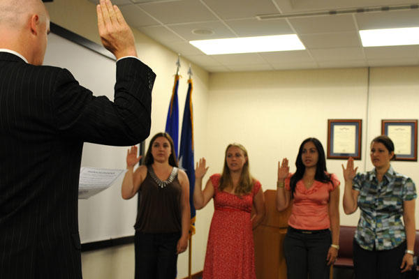 Four military spouses take the Oath of Allegiance during a naturalization ceremony in 2010. Staff Sgt. Nadine Y. Barclay/Air Force
