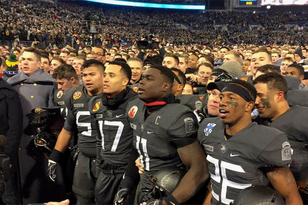 Army football players sing their alma mater after beating Navy for the first time in 15 years. (Military.com/Michael Hoffman)