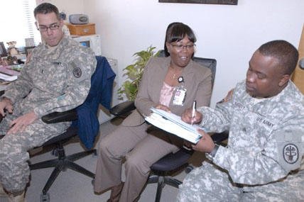 soldier signs paperwork 428x285