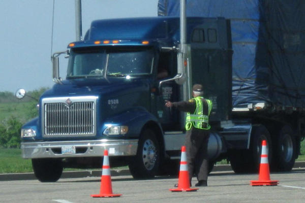 Semi truck driver on a training course test.