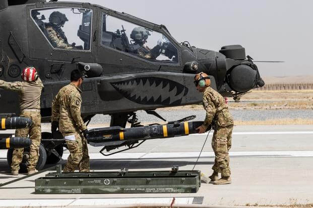 U.S. Army Soldiers assigned to Task Force Griffin, 16th Combat Aviation Brigade, 7th Infantry Division load an AGM-114 Hellfire missile on an AH-64E Apache helicopter in Kunduz, Afghanistan, May 31, 2017. The Griffins are working hard to support U.S. Forces Afghanistan as part of Operation Freedom's Sentinel and Resolute Support Mission.