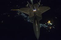 A KC-10 Extender from the 908th Expeditionary Air Refueling Squadron, Al Dhafra Air Base, United Arab Emirates, refuels an F-22 Raptor from the 95th Expeditionary Fighter Squadron in support of a new offensive campaign in Afghanistan Nov. 19, 2017. (U.S. Air Force Photo by Gregory Brook)