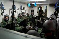 Students in a Specialized Undergraduate Pilot Training class learn what it’s like to breath oxygen for an extended period of time in an altitude chamber. (U.S. Air Force/ Staff Sgt. Austin M. May)