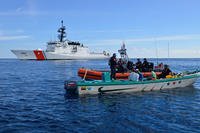 A boarding team aboard the Coast Guard Cutter Stratton apprehends four suspected drug smugglers in international waters in the drug transit zone of the Eastern Pacific Ocean, February 23, 2017. (U.S. Coast Guard photo/Mark Barney)