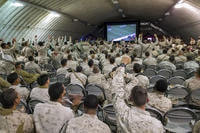 Marines and sailors cheer during Super Bowl LI in the dining facility at Camp Wilson on board Marine Corps Air Ground Combat Center, Twentynine Palms, Calif., Feb. 5, 2017. (US Marine Corps photo/Levi Schultz)