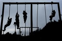FILE PHOTO -- U.S. Marine candidates with Officer Candidates school (OCS) participate in an obstacle course at OCS, Marine Corps Base Quantico, Va., on Jan. 16, 2018. (U.S. Marine Corps/Lance Cpl. Yasmin D. Perez)