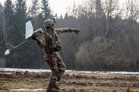 Spc. William Ritter, a military policeman with 287th Military Police Company, 97th Military Police Battalion, 89th Military Police Brigade, Fort Riley, Kansas, prepares to launch the RQ-11 Raven, small unmanned aerial system (SUAS), into the air during Allied Spirit VIII at Hohenfels, Germany, Jan. 26, 2018. (Dustin D. Biven/U.S. Army)