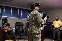 A 366th Training Squadron electrical systems apprentice course student at Sheppard Air Force Base, Texas, tests out a new medium of training, which involves virtual reality while digital designers James Rumfelt and Felton Joshua supervise the experience Jan. 26, 2018. (U.S. Air Force/Airman 1st Class Pedro Tenorio)