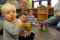 Babies play at a Coast Guard child development center. (U.S. Coast Guard/Donnie Brzuska)