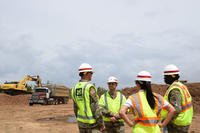 U.S. Army Corps of Engineers Task Force Puerto Rico Recovery Commander Lt. Col. Scott Snyder (left), and Lt. Ioannis Wallingford discuss ongoing debris management efforts in Vega Baja, Puerto Rico, with New Orleans District Deputy Commander Maj. Jordan Davis (right) and Sarah Stone on June 29, 2018. (U.S. Army photo/Jenn Miller)