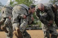 U.S. Army Capt. Kristen Griest, middle, carries a fellow Soldier as part of combative training during the Ranger Course on Ft. Benning, GA., April 20, 2015. (U.S. Army/Spc. Nikayla Shodeen)