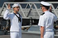 DC2(SW) Sher F. Singh, from the USS Anzio (CG-68), re-enlisted aboard the USS Wisconsin (BB-64) in front of members of his command and family (US Navy/Civilian Public Affairs Officer Max Lonzanida)