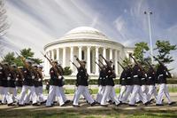 The Marine Corps Silent Drill Platoon marches in front of the Thomas Jefferson Memorial on their way to perform for the Cherry Blossom Festival in Washington D.C., April 13, 2014. (U.S. Marine Corps/Sgt. Bryan Nygaard)